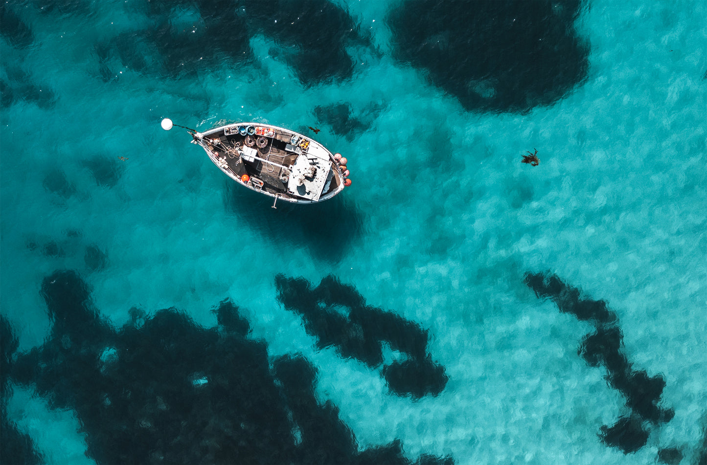 Aerial view of fishing boat in clear aqua waters – minimalist Tasmanian coastal print
