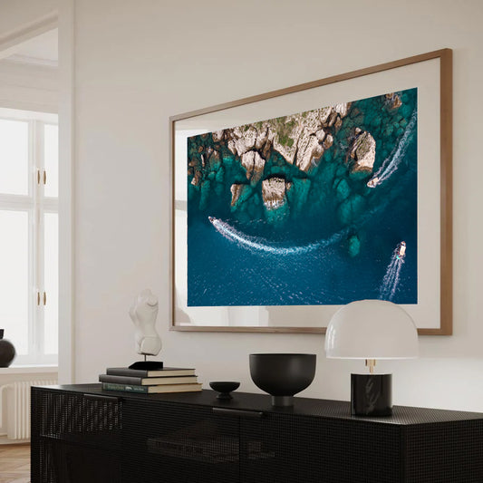Abstract coastal aerial photo showing textured cliff edges and vibrant turquoise sea near Taormina, Sicily.