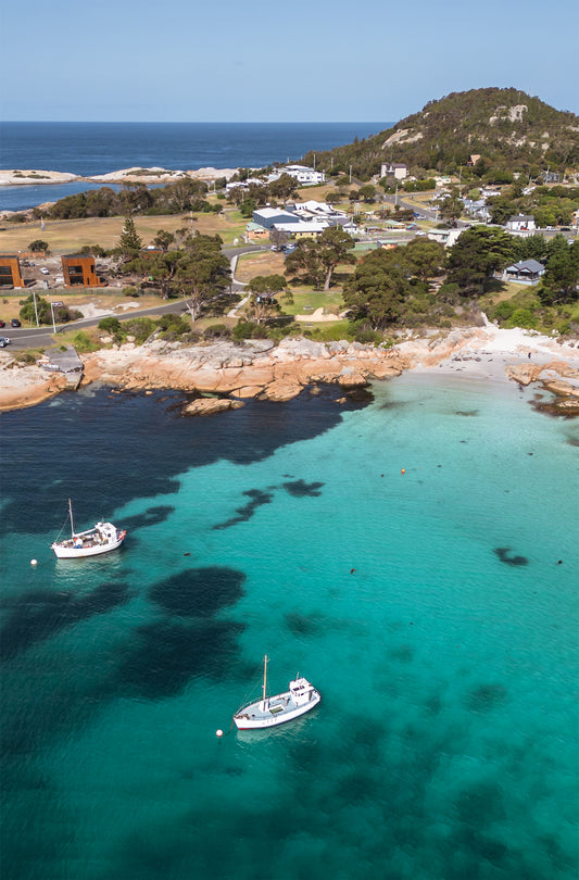 Portrait coastal print of Wubbs Beach in Bicheno, Tasmania with turquoise water and rocky shoreline