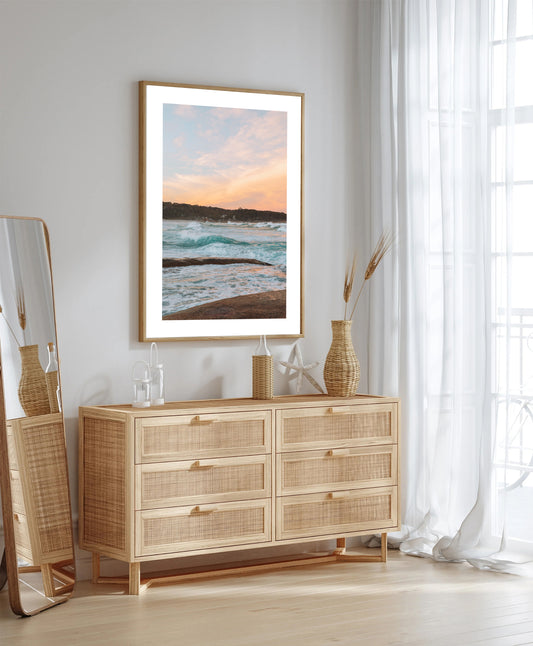 Peachy sunset over ocean viewed from rocks at Bay of Fires print