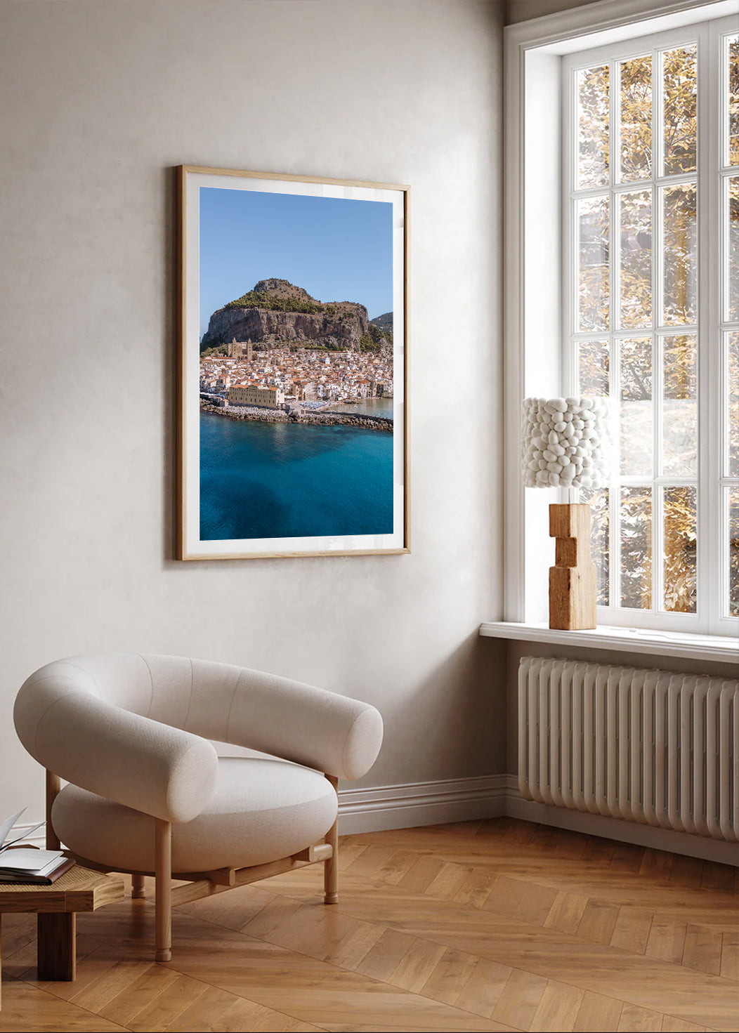 Portrait aerial coastal wall art photograph of Cefalù Beach in Sicily with blue Mediterranean water and shoreline.