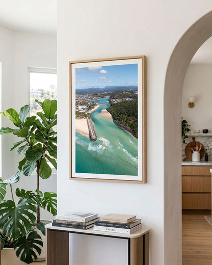 Tallebudgera Creek aerial print in a natural oak frame styled in an entryway