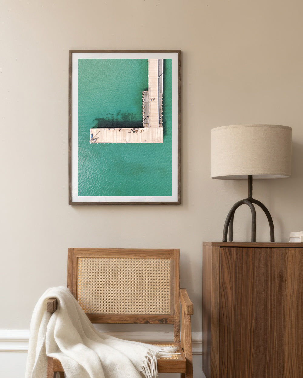 Frankston Pier overhead aerial print in a dark frame styled in a living room