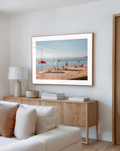 Dromana Beach Mornings print in a natural oak frame styled in a living room
