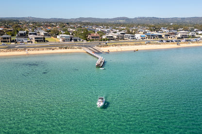 Aerial print of Safety Beach jetty and a boat on turquoise water, Mornington Peninsula – coastal wall art