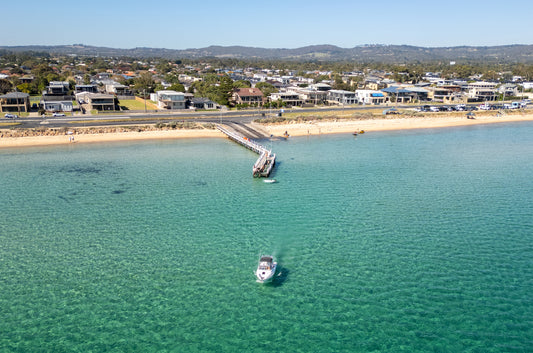 Aerial print of Safety Beach jetty and a boat on turquoise water, Mornington Peninsula – coastal wall art